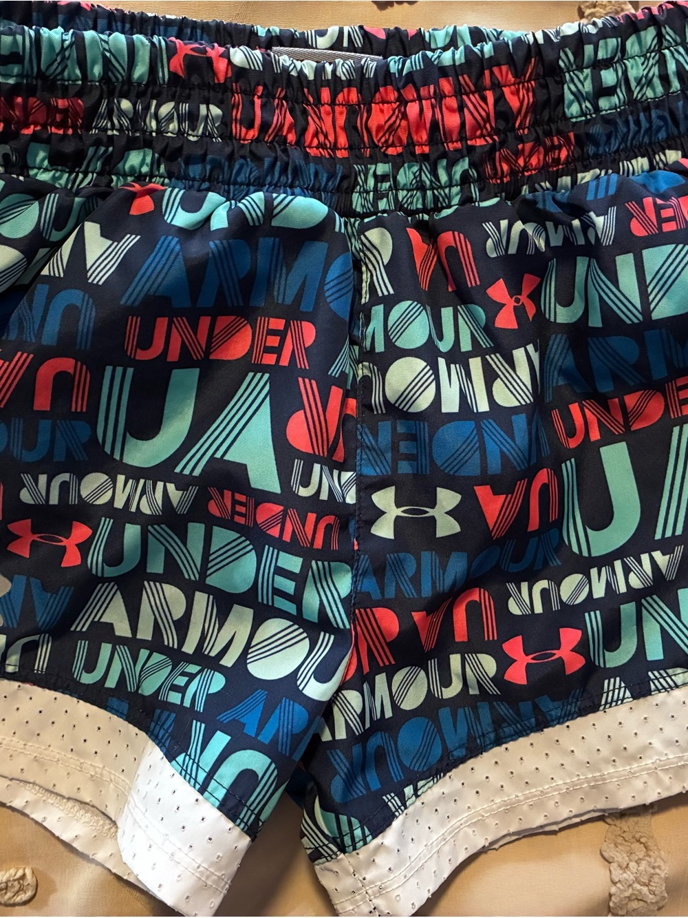 Under Armour Navy Athletic Shorts with Teal and Red Logo Print